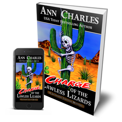 Book and phone display Ann Charles Store’s Book 7, Charge of the Lawless Lizards—skeleton on a desert cactus.